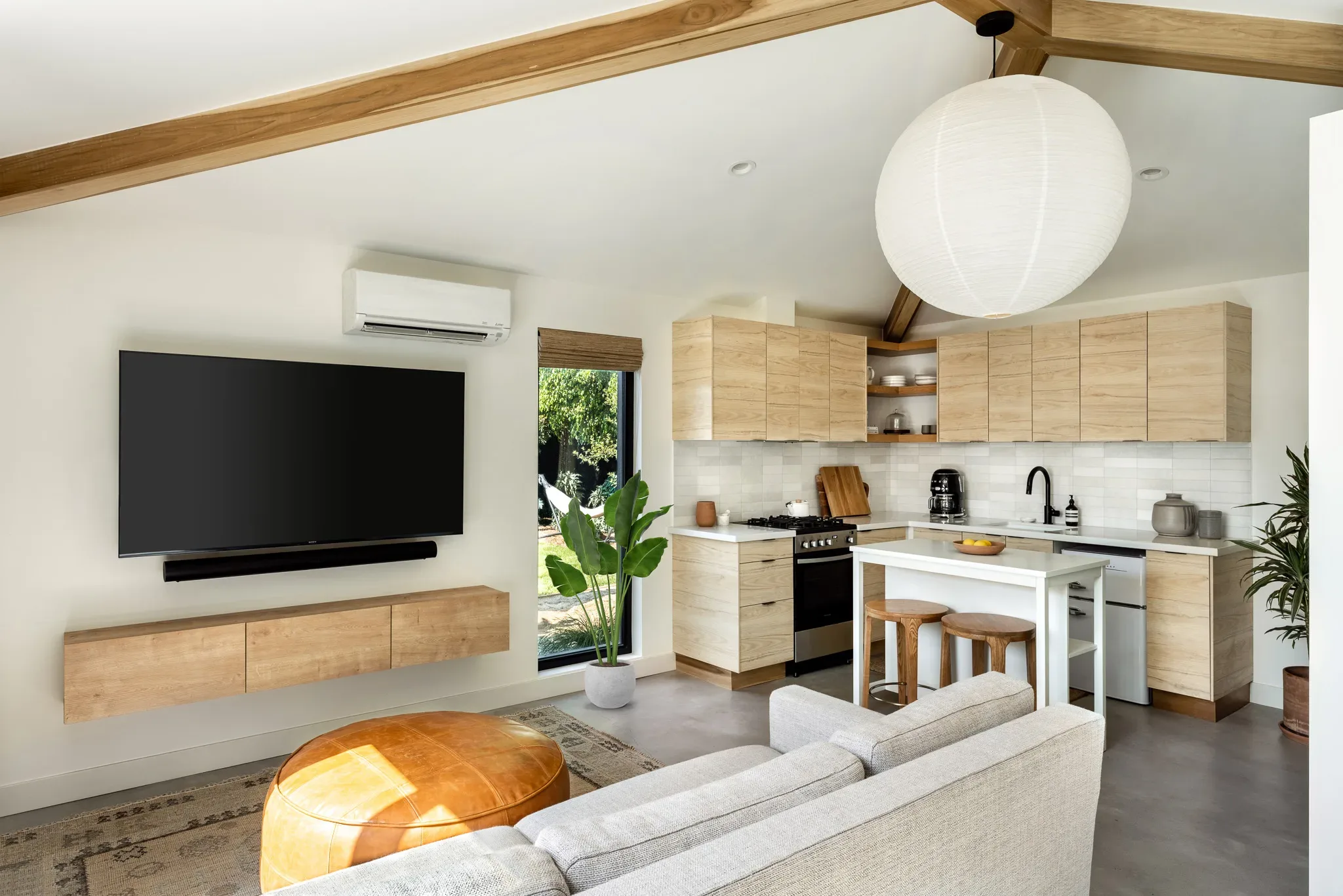 A kitchen and living room in a tiny house.