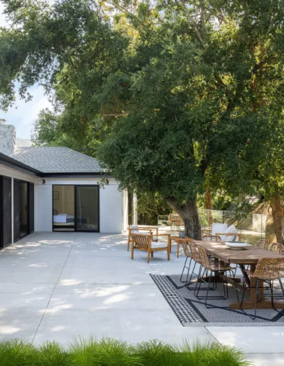 A patio with a table and chairs.