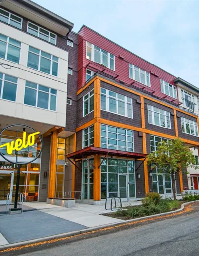 A building with a yellow and orange sign on it.