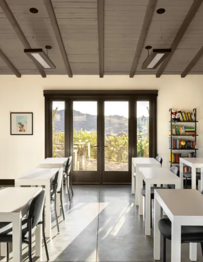 A rendering of a classroom with desks and chairs.