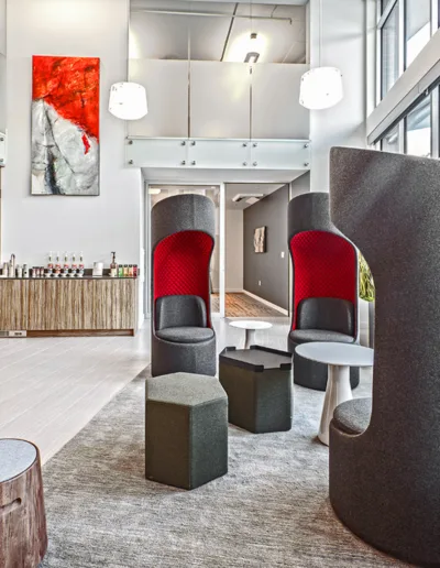 A modern office with chairs and a coffee table.